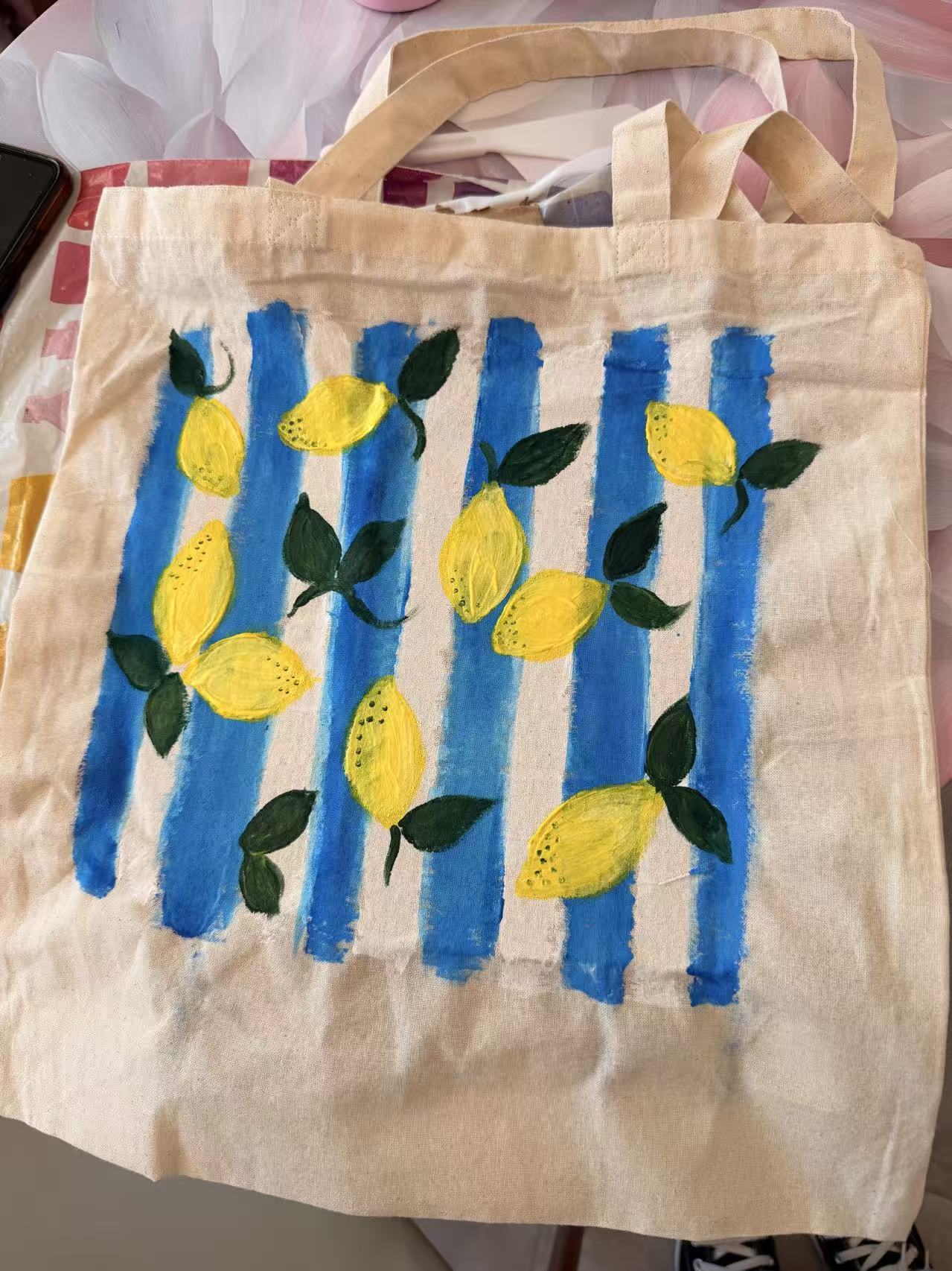 Painted tote bag with blue stripe pattern as DIY workshop result in Magdeburg