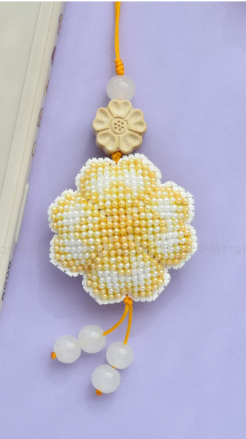 Cross-stitch charm - Yellow flower at Kleines Glück in Magdeburg