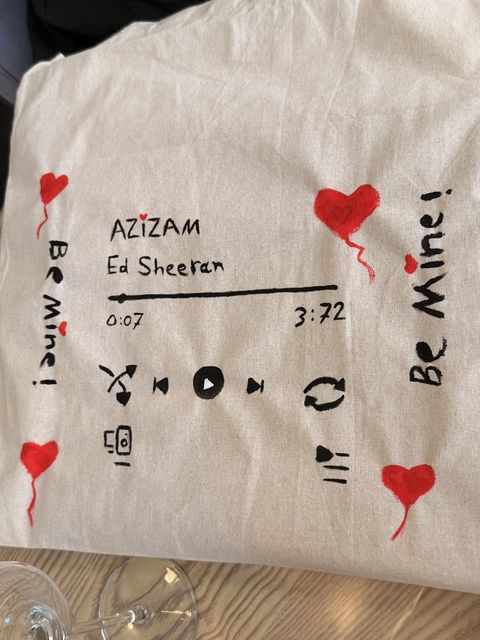 Hand-painted tote bag with hearts and a music design