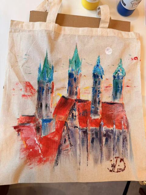 Tote bag painted with gothic cathedral towers in red and blue watercolour