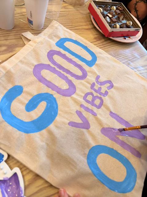 Tote bag with GOOD VIBES ON lettering in blue and lilac
