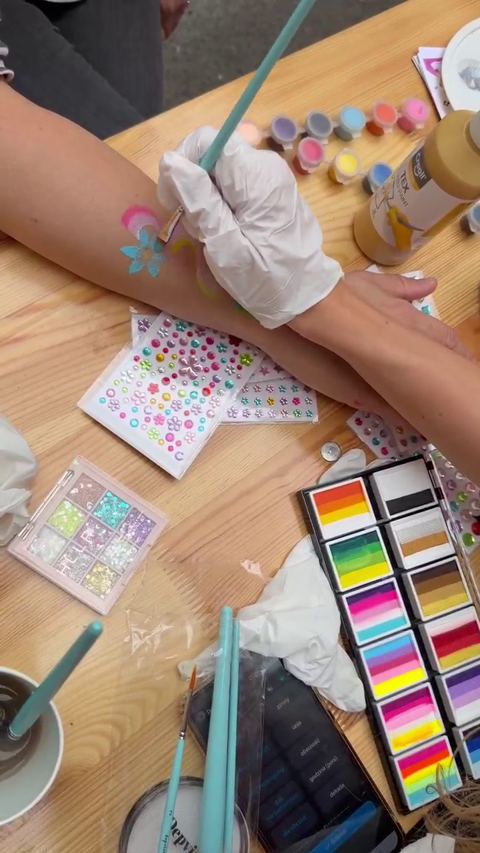 Video: glitter painting on an arm, close up